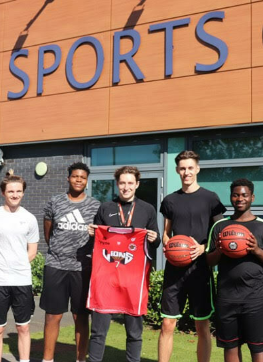 Bede College Coach Anthony Reed with some players from the new Basketball Academy